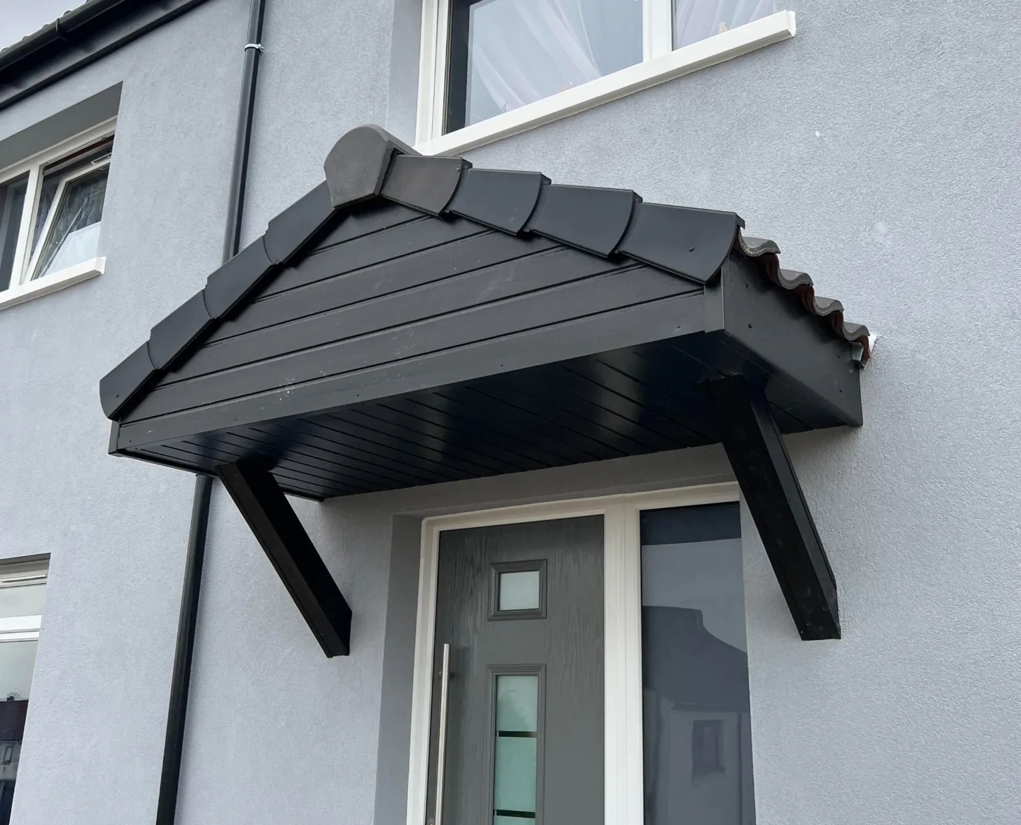 Tiled door canopy, general building work