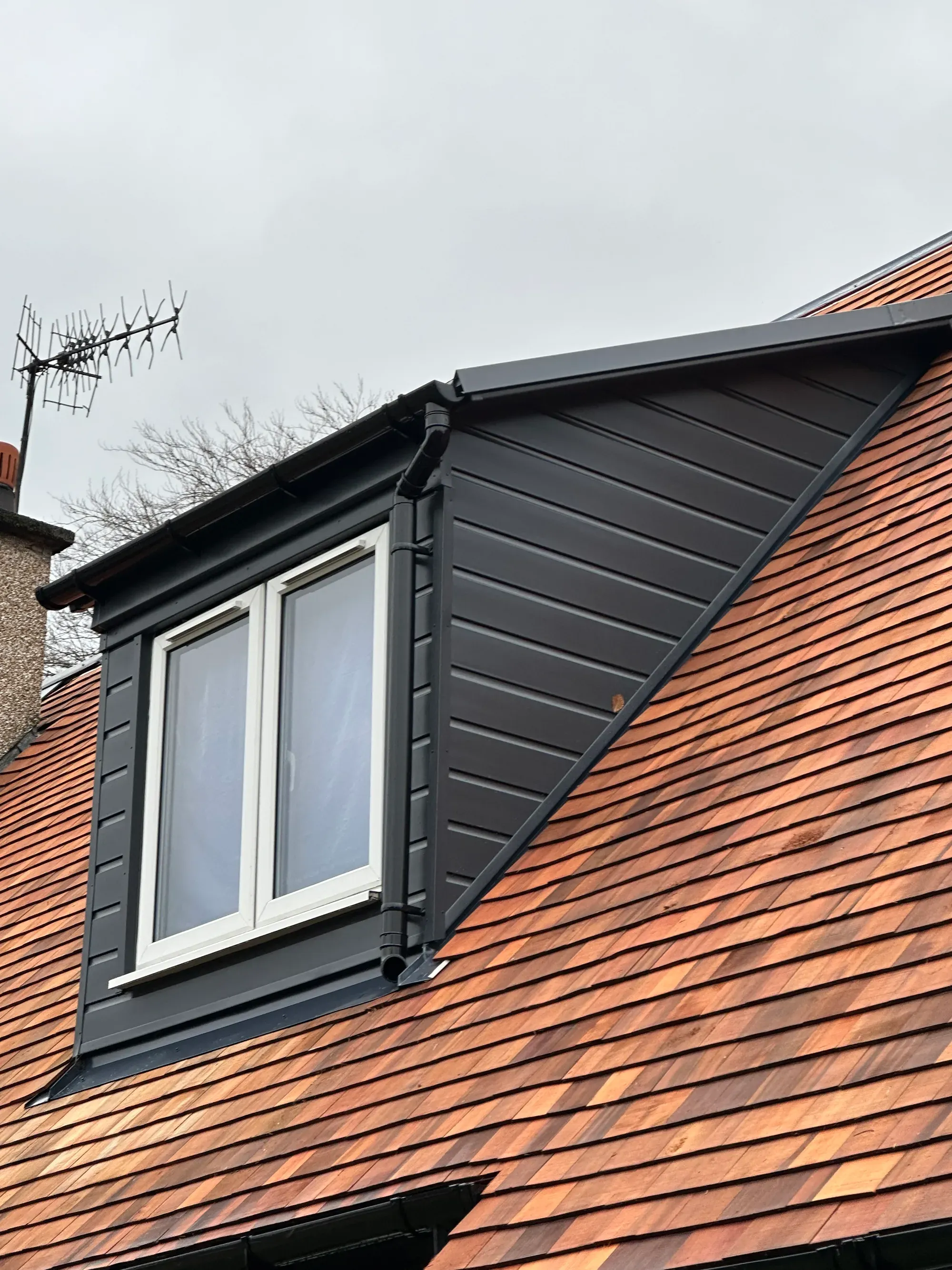 Dormer cladding with new roof windows