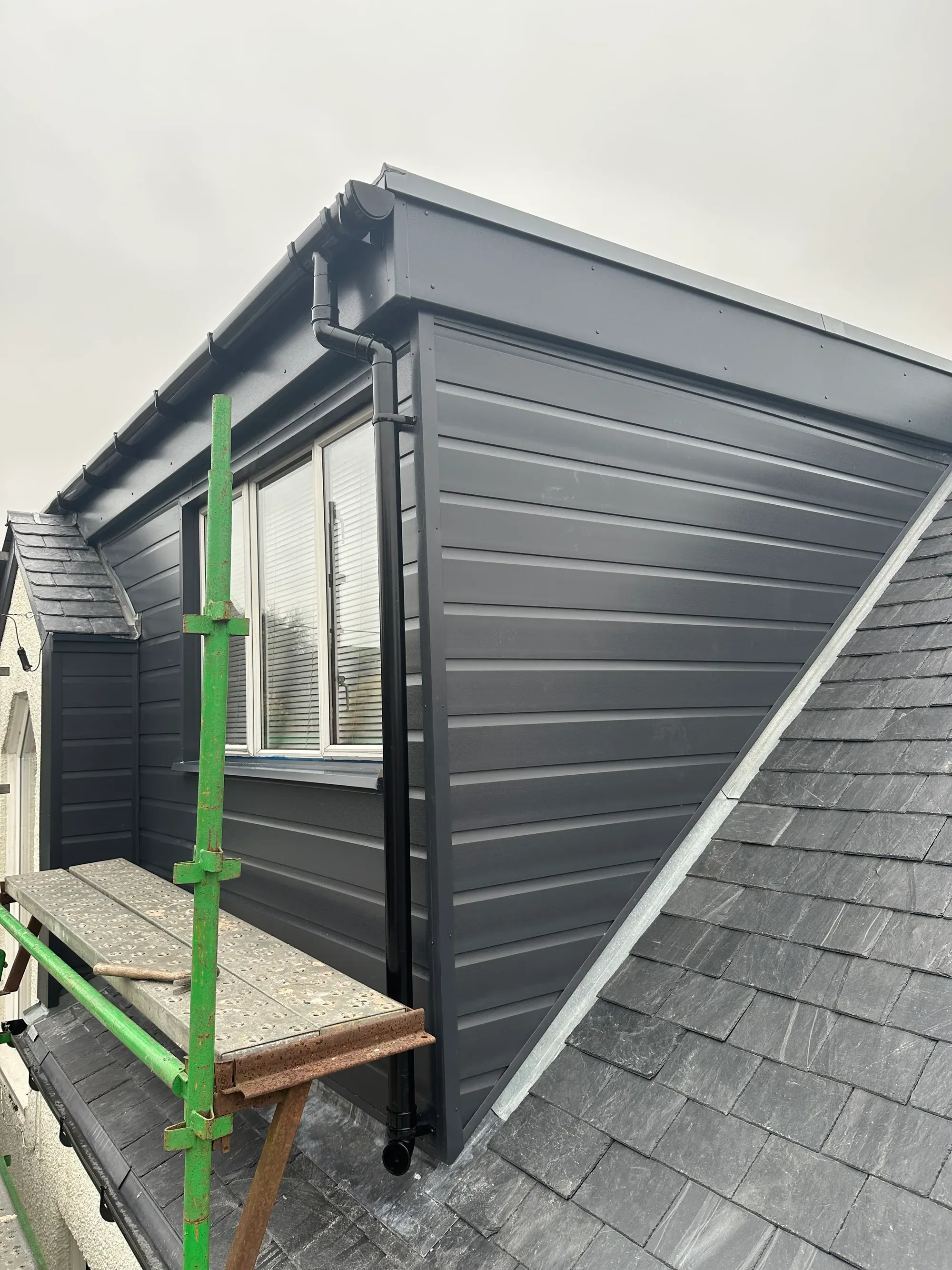 Dark-clad dormer with new guttering
